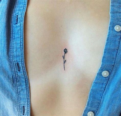 small tattoos between breast|Between Breast Tattoo Meaning: Personal Stories。